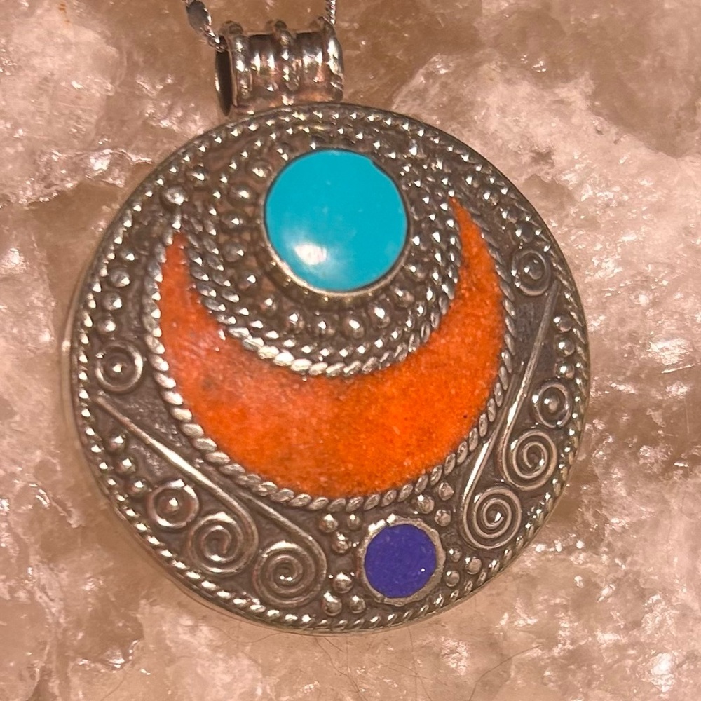 Silver and Blue Circular Necklace with Intricate Design